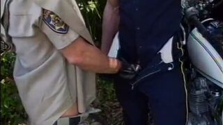 Two stud cops drop their pants and suck each other off - 4 image