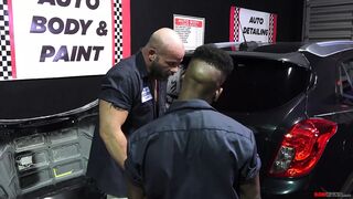 Muscular mechanic fucks his black employee in the shop - 1 image