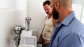 Trashy Dudes Engulfing Large Dong At A Urinal - 1 image