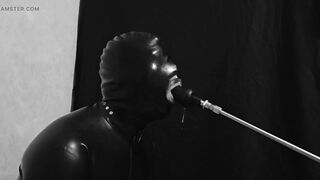 Rubber gimp train is throat with fuck machine