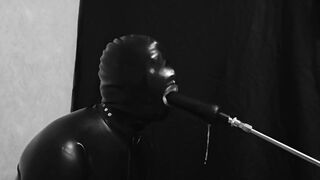 Rubber gimp train is throat with fuck machine