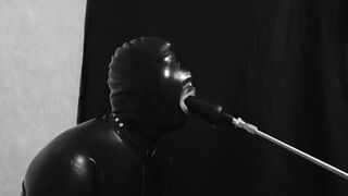 Rubber gimp train is throat with fuck machine