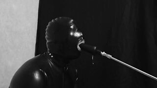 Rubber gimp train is throat with fuck machine