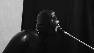 Rubber gimp train is throat with fuck machine
