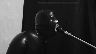 Rubber gimp train is throat with fuck machine