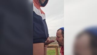 A Guy Gives a Blowjob to a Guy with a Big Cock Outdoors Until He Gives Him a Good Facial - 12 image